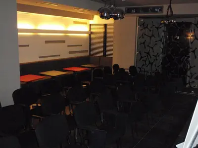 an empty room with desks and chairs in it at Famous House in Plovdiv