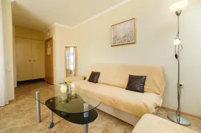 a living room with a couch and a glass table at Noviz Hotel in Plovdiv