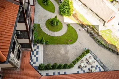 an overhead view of a garden in a building at Rhodopi Home Hotel Chepelare- Half Board & Wellness in Chepelare
