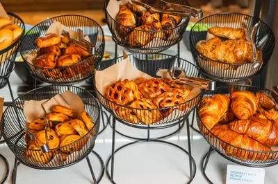 a bunch of baskets filled with bread and pastries at Four Points by Sheraton Bansko in Bansko