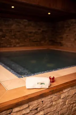 a towel sitting next to a swimming pool at Mura Hotel in Bansko