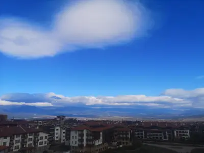a view of a city with a cloudy sky at Royal Bansko Family Apart Hotel - All Inclusive Light or Half Board & Drinks With Heated Indoor Pool & Jacuzzis in Bansko