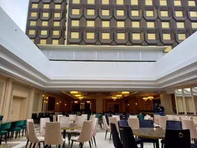 a room with tables and chairs and a building at Astoria Grand Hotel in Sofia