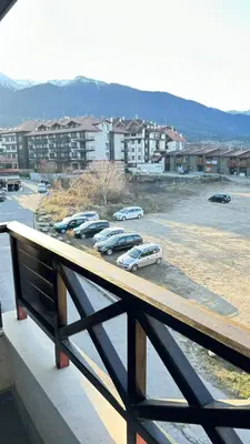 a group of cars parked in a parking lot at Aparthotel Aspen in Bansko