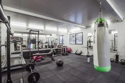 a room with a gym with a large rocket at Villas Jagoda & Malina in Borovets