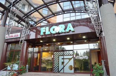 a flanca store with a sign on the front of it at Persey Flora Apartments in Borovets
