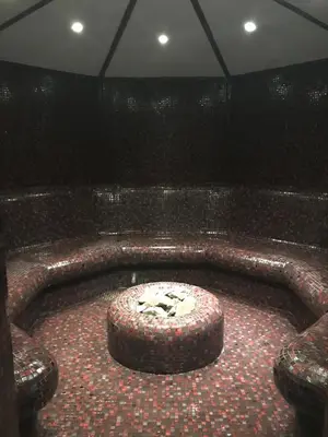 a room with a bath tub in the middle of a room at Borovets Hills Ski & Spa - Half Board in Borovets
