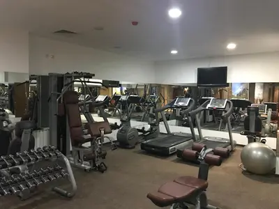a gym with a bunch of exercise equipment in it at Borovets Hills Ski & Spa - Half Board in Borovets