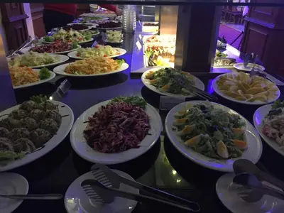 a buffet line of plates of food on a table at Borovets Hills Ski & Spa - Half Board in Borovets