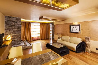 a living room with a couch and a table at Hotel Anel in Sofia