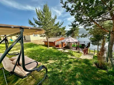 a yard with a gazebo and a table at Villa Eti in Dospat