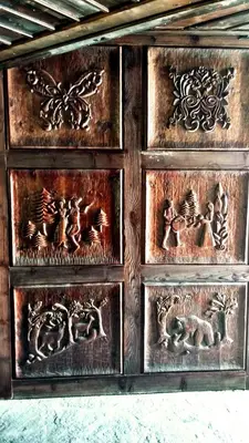 a wooden cabinet with many different animals on it at Family hotel Valchanovata Kashta in Fotinovo