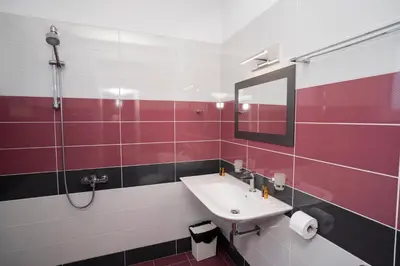 a bathroom with a sink and a mirror at Guest house Traikovi in Petrich