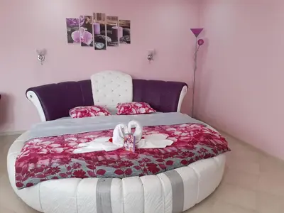 a bedroom with a bed with a doll on it at Safi in Dospat