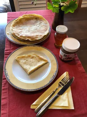 two plates of food on a table with a pie at Mountain View Vacation Home in Balabanska