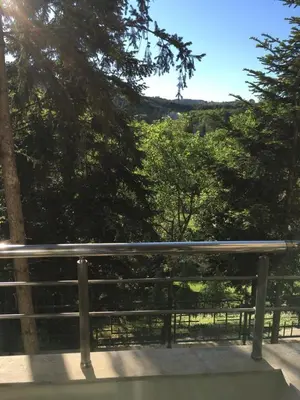 a bench sitting on the side of a road at Park View Studios in Sandanski