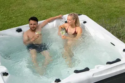 a man and a woman in a hot tub at Villa Vanessa Koprivki Area in Tsar Kaloyan