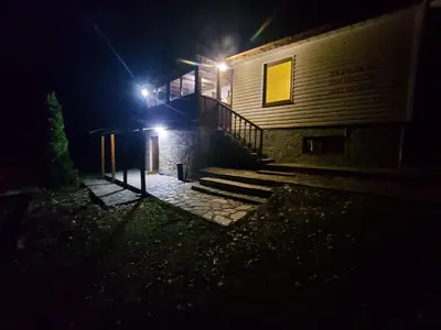 a house at night with lights on the stairs at Villa Vanessa Koprivki Area in Tsar Kaloyan