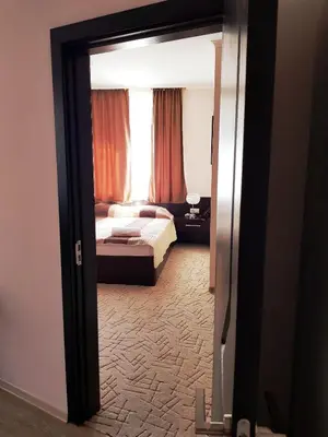 a view of a bedroom with a bed and a window at Central Guest Rooms in Asenovgrad