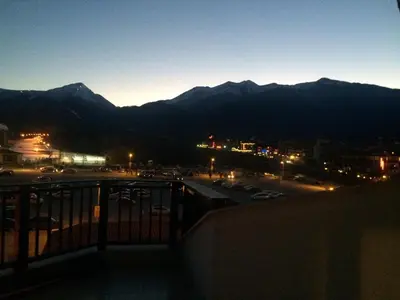 a view of a city at night with mountains at Mountain Paradise 4 Apartments in Bansko