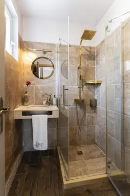 a bathroom with a sink and a shower at ArtCity Villa - 3 Boutique Suits in Historic town in Plovdiv