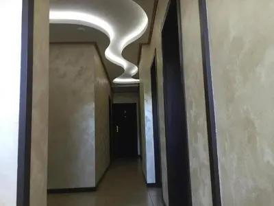 a hallway with a white ceiling in a building at Hotel Chamishki in Blagoevgrad