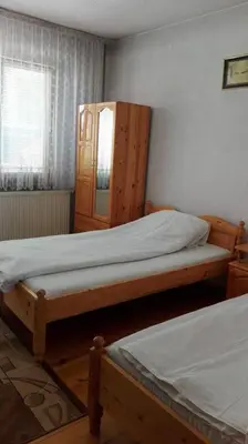 a bedroom with two bunk beds and a window at Tsvetkovi Guest House in Dobrinishte