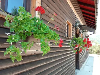 a building with flowers on the side of it at Villa AdiArt in Arda