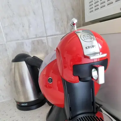 a red mixer sitting on top of a counter at Asen 36 Apartment in Sofia