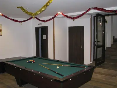 a snooker table in a room with a pool at Park Hotel Eagle Stone in Koprivshtitsa