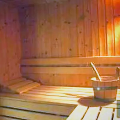 a bucket sitting on the floor of a wooden wall at Studio in Borovets Gardens Complex in Borovets