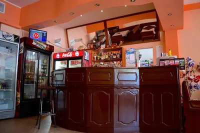 a bar in a restaurant with a counter at Complex Pele in Zmeitsa