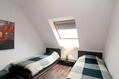 a bedroom with two beds and a skylight at Sofia Top Lux Apartment in Sofia