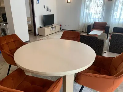 a meeting room with a white table and chairs at Stenata Huge Ski To Door Apartments in Pamporovo
