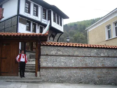 a man standing in the doorway of a building at Popsokol House in Bratsigovo