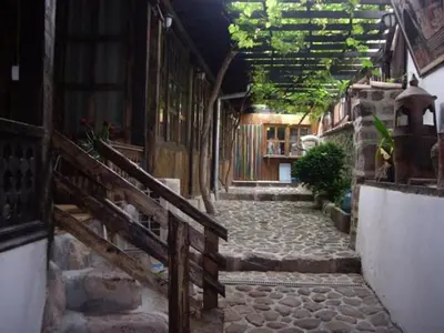 an alley with a stone walkway in a building at Popsokol House in Bratsigovo