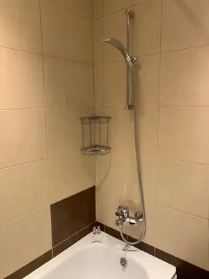 a bathroom with a shower and a sink at GM Royal Plaza in Borovets