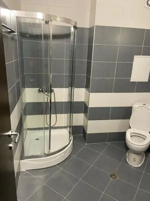 a bathroom with a shower and a toilet at Ski Apartment Boyika Iglika 2 in Borovets