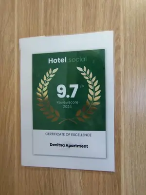 a sign with a laurel wreath on a door at Denitsa Apartment in Borovets