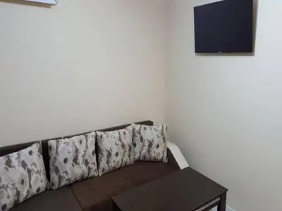 a living room with a couch and a table at Ayberk Apart Sandanski in Sandanski