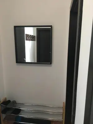 a mirror hanging on a wall in a room at Iglika 2 Ski Apartment in Borovets