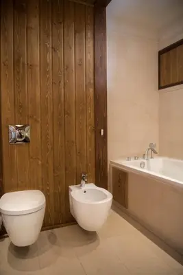 a bathroom with a toilet and a sink and a tub at Villa Nataly at Golf Resort in Bansko