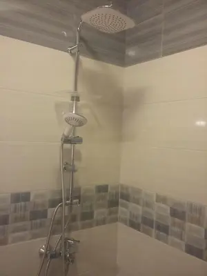 a bathroom with a shower with a shower head at Central Studio Maritsa in Plovdiv
