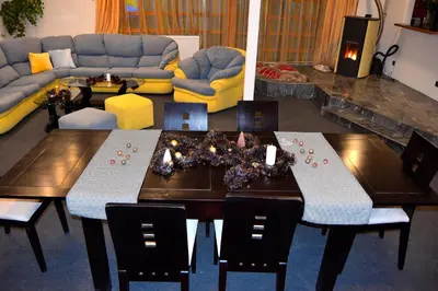 a living room with a table and a couch at Persey Villa Borovets in Borovets