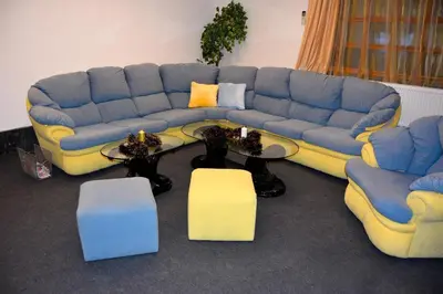 a living room with a blue and yellow couch at Persey Villa Borovets in Borovets