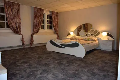 a bedroom with a bed and a large mirror at Persey Villa Borovets in Borovets