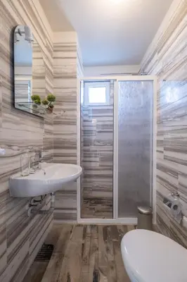 a bathroom with a sink and a shower at Blue Label Apart House in Sofia