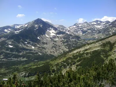 a view of a mountain range with snow capped mountains at Guest House Garbevi in Dobrinishte