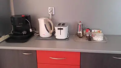 a kitchen counter with a coffee maker and a blender at Central Park Studio in Plovdiv