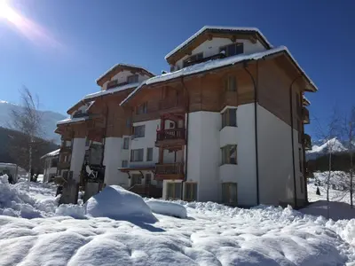 a building covered in snow with snow around it at PM Mountain View Fireside Retreat Bansko in Bansko